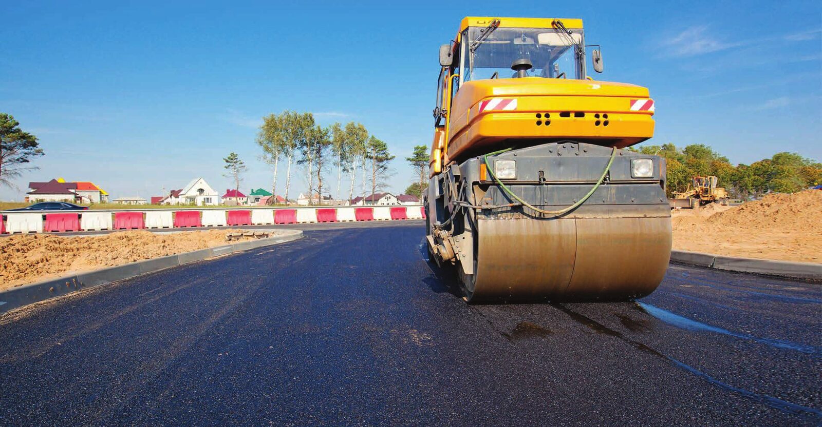 Road roller finishing a hot mix asphalt surface